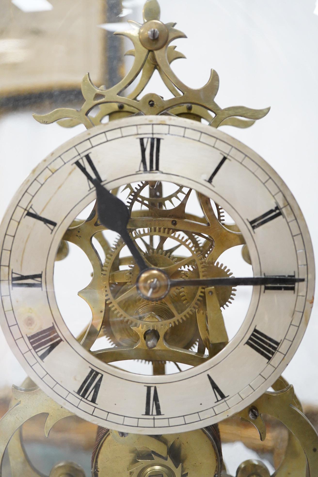 A 19th century skeleton timepiece under a dome, 41cm